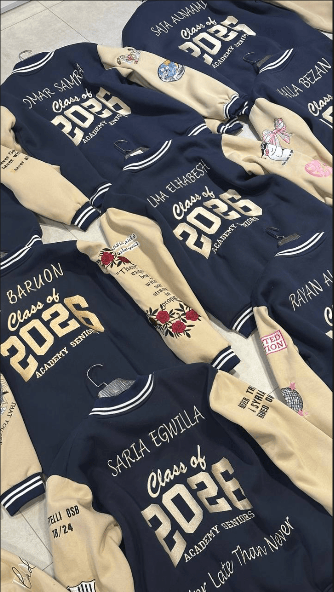 cream varsity, names on back